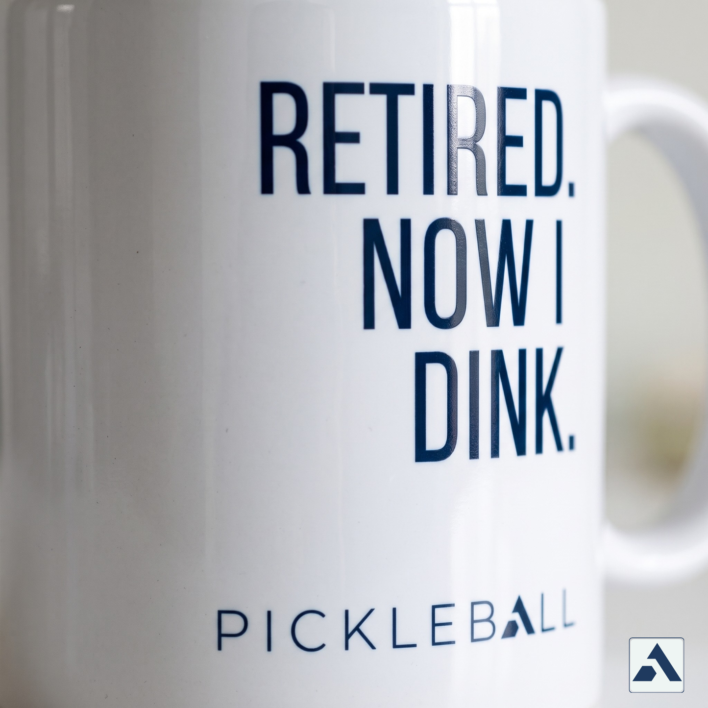 Retired. Now I Dink. pickleball mug — close-up of the navy print and PICKLEBALL lockup