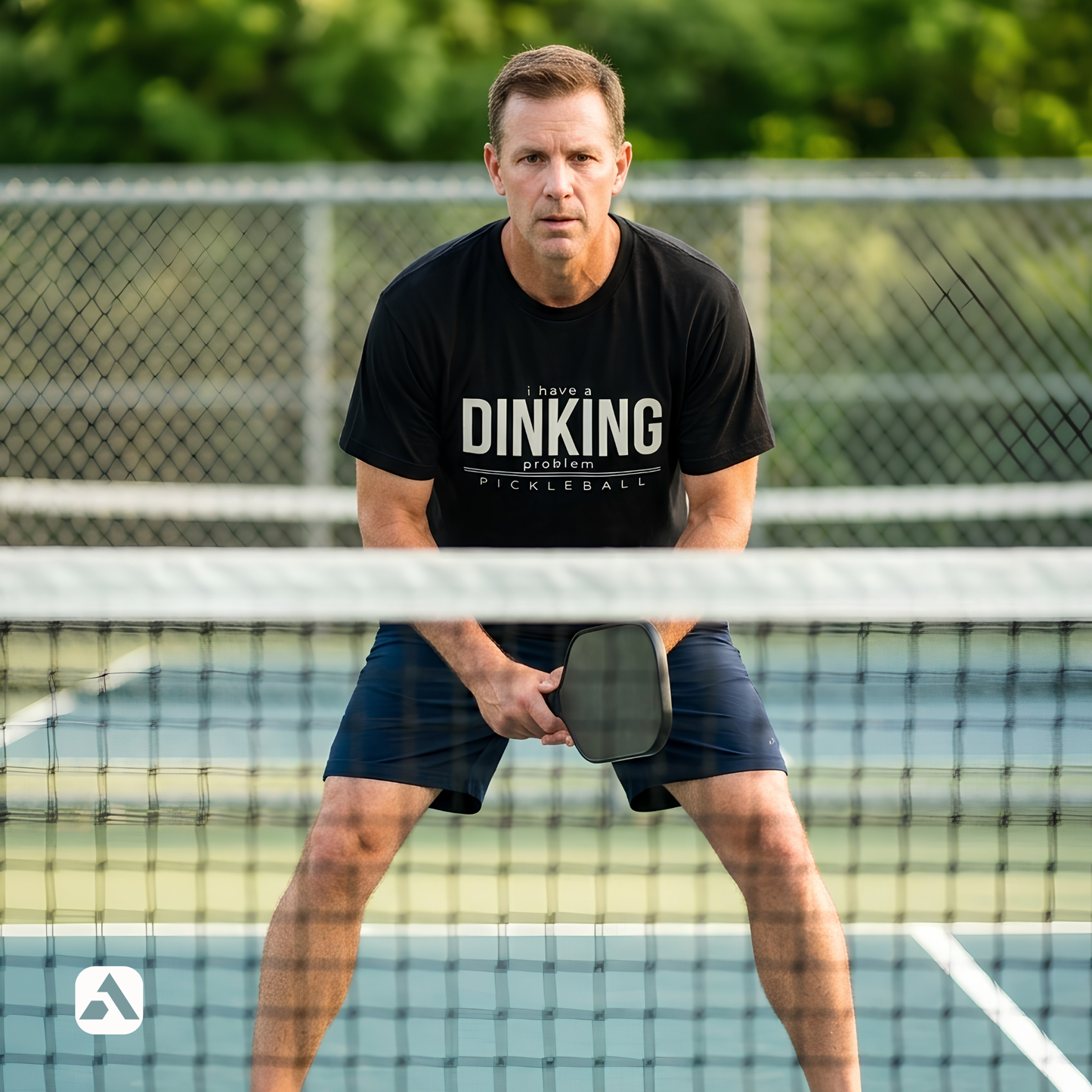 I Have a Dinking Problem pickleball t-shirt, Black — player in ready stance at the net